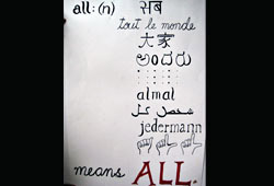 All means all in every language [poster has, hindi, French, Japanese, Telegu, Braille, Arabic, Sign language]